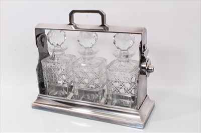 Lot 3845 - Silver plated three bottle tantalus