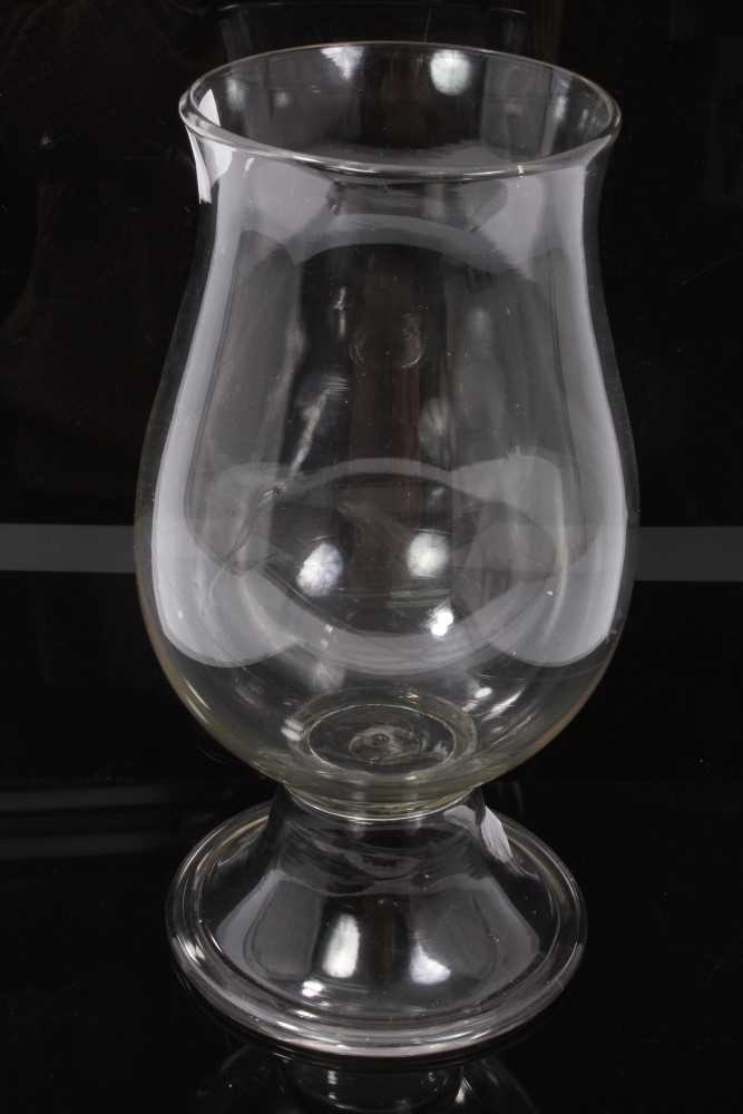 Lot 84 - Georgian glass storm lamp, of baluster form on splayed foot with rough pontil mark, 30cm height