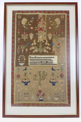 Lot 3133 - Large 19th century sampler with love heart borders, flowers trees and text. Framed and glazed.