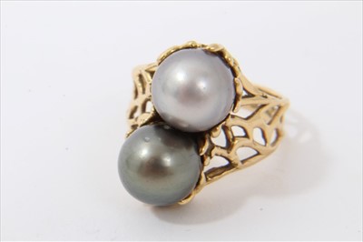 Lot 3354 - Cultured grey pearl two-stone ring in gold abstract setting