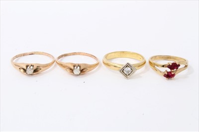 Lot 3344 - Four yellow metal gem set rings