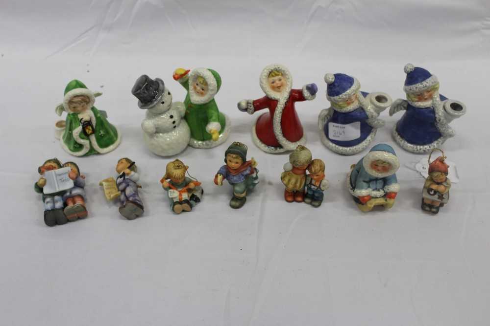 Lot 2149 - Six Goebel Christmas figures (including 11705, 11708, 42 009-09 x 260, 42412-09) and six Hummel Christmas decorations, including certificates naming them as Christmas Cookies, Little Gift Wrapper,...