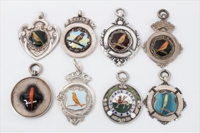 Lot 3727 - Group of eight antique enamelled silver canary and other birding club medals