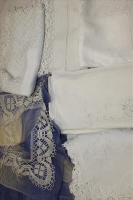 Lot 3139 - A selection of table linens with lace-work including crochet, bobbin lace and cut-out work.  Plus an example of Buckingham bobbin lace tray cloth edging displayed on blue tissue paper.