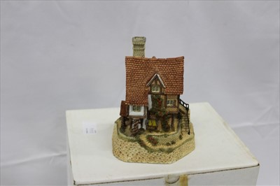 Lot 2164 - Collection of boxed David Winter cottage ornaments, to include Arches Thrice, Lace Makers Cottage, On The Riverbank, Scrooge's Family Home Plaque, and Eggars Hill Christmas plaque (5)