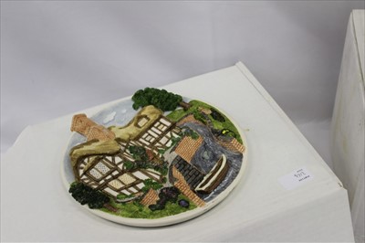 Lot 2164 - Collection of boxed David Winter cottage ornaments, to include Arches Thrice, Lace Makers Cottage, On The Riverbank, Scrooge's Family Home Plaque, and Eggars Hill Christmas plaque (5)