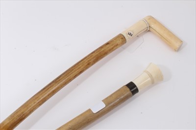 Lot 3683 - Unusual walking stick with heavy pale wood shaft, white metal collar and turned ivory handle, 87.5cm overall length