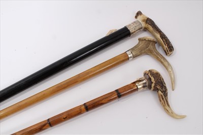 Lot 3672 - Heavy Edwardian walking stick with ebony shaft, silver collar (Chester 1908) and Antler crop handle, another George V with stepped cane shaft, silver collar (Birmingham 1913 Mappin & Webb) and deco...