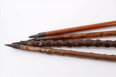 Lot 741 - Four Alpine walking sticks with Ibex horn handles and spiked ferrules, one inscribed "Interlaken" and another "Rigi-Kulm Pilatus Tomlishoon Furka Rohne Glacier etc". All four approximately 94cm ov...