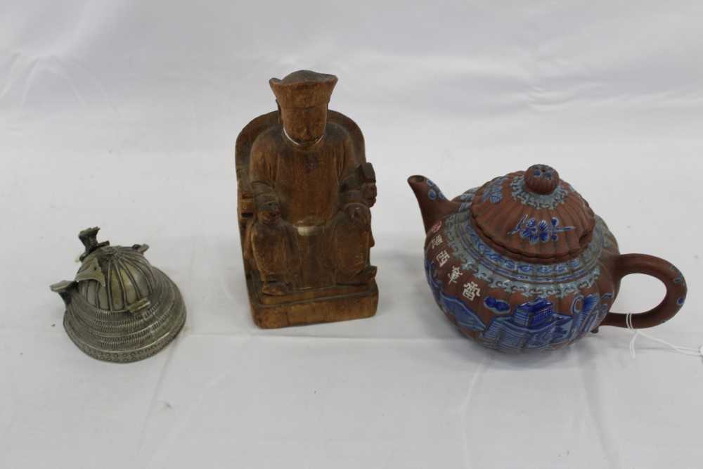 Lot 3736 - Three Chinese items 19th to 20th century, including Yixing teapot with blue enamel decoration and white enamel character marks, a carved wooden temple figure reputedly wahed up on the shore of a ri...