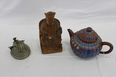 Lot 3736 - Three Chinese items 19th to 20th century, including Yixing teapot with blue enamel decoration and white enamel character marks, a carved wooden temple figure reputedly wahed up on the shore of a ri...