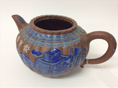 Lot 3736 - Three Chinese items 19th to 20th century, including Yixing teapot with blue enamel decoration and white enamel character marks, a carved wooden temple figure reputedly wahed up on the shore of a ri...