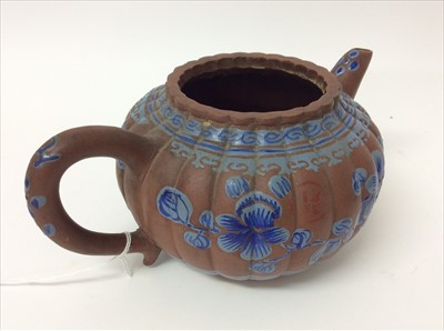 Lot 3736 - Three Chinese items 19th to 20th century, including Yixing teapot with blue enamel decoration and white enamel character marks, a carved wooden temple figure reputedly wahed up on the shore of a ri...