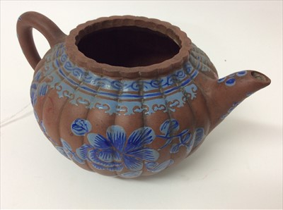 Lot 3736 - Three Chinese items 19th to 20th century, including Yixing teapot with blue enamel decoration and white enamel character marks, a carved wooden temple figure reputedly wahed up on the shore of a ri...