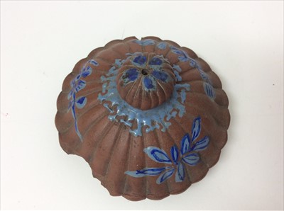 Lot 3736 - Three Chinese items 19th to 20th century, including Yixing teapot with blue enamel decoration and white enamel character marks, a carved wooden temple figure reputedly wahed up on the shore of a ri...