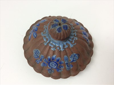 Lot 3736 - Three Chinese items 19th to 20th century, including Yixing teapot with blue enamel decoration and white enamel character marks, a carved wooden temple figure reputedly wahed up on the shore of a ri...