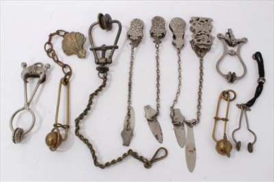 Lot 3740 - Collection of 10 antique Victorian and later ladies' skirt lifters, including several with chains, one with a stamped Victorian registration mark (10)