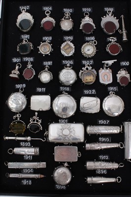 Lot 3376 - Collection late Victorian silver watch chain fobs including hardstone inlaid and compasses , two silver Sovereign cases, cigarette holders in silver cases and silver boxes and compacts (36)