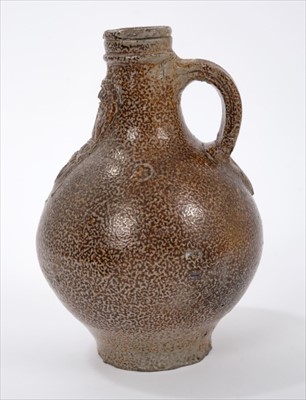 Lot 38 - Unusual small-sized 17th century Rhenish stoneware Bellarmine bottle with string collar