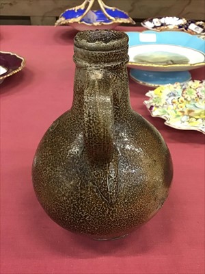 Lot 38 - Unusual small-sized 17th century Rhenish stoneware Bellarmine bottle with string collar