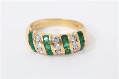 Lot 3434 - 18ct gold emerald and diamond ring with triple rows of emeralds and diamonds in 18ct channel setting.