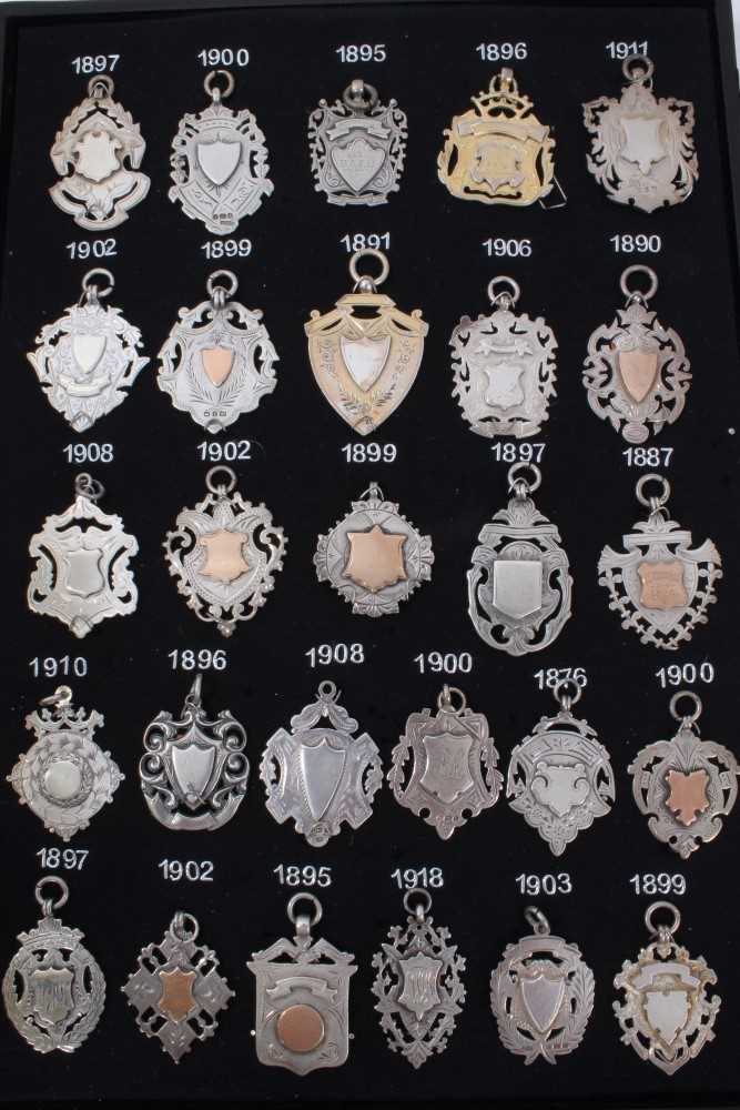 Lot 3380 - Collection twenty five Late Victorian and Edwardian silver watch fobs (25)