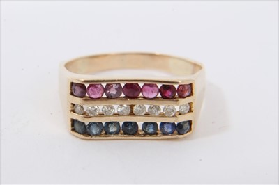 Lot 3436 - Diamond, ruby and sapphire triple row ring with round cut stones in 14K yellow gold channel setting