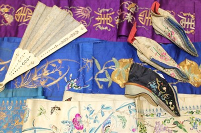 Lot 3157 - Antique Chinese hand embroidered silk panels including two pairs of sleeve bands and a pair of shoes plus one other.