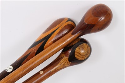 Lot 3700 - Three marquetry topped walking sticks of intricate design incorporating different woods, varying lengths