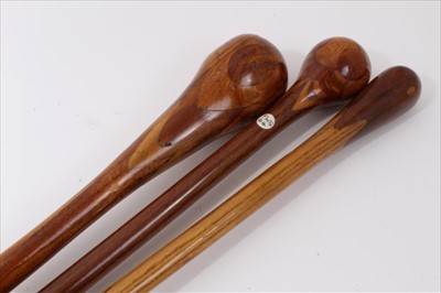 Lot 744 - Three marquetry topped walking sticks of intricate design incorporating different woods, varying lengths