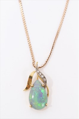 Lot 3442 - Opal and diamond pendant with a pear shaped opal cabochon in diamond set mount on chain