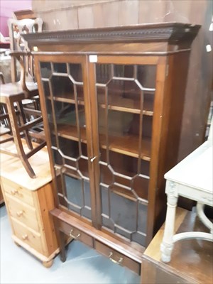 Lot 872 - Good quality Edwardian mahogany bookcase with dentil cornice, adjustable shelves enclosed by two astragal glazed doors above two drawers below on square taper legs terminating on spade feet. Retail...