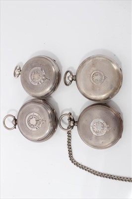 Lot 3394 - Four late Victorian and Edwardian silver open face keys wind pocket watches , over with silver chain (5)