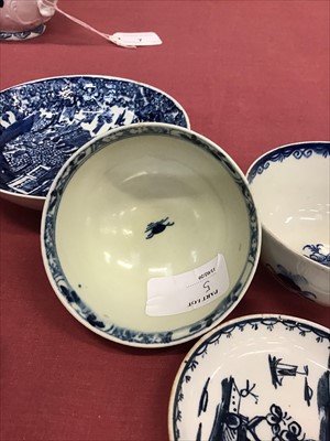 Lot 5 - Small collection of 18th century Lowestoft porcelain, including a butter boat painted with the Two Porter pattern, circa 1770. Also a Lowestoft printed saucer, circa 1790, a toy saucer, circa 1768,...