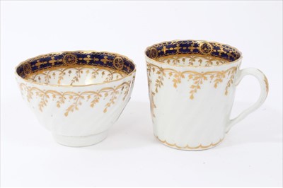 Lot 8 - Fine 18th century Chamberlains Worcester tea trio, with spiral moulding, decorated with the standard pattern 60, each piece painted en grisaille  with different titled views - Pembroke, Worcester a...