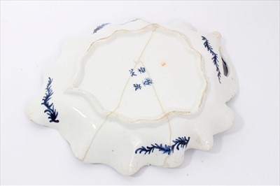 Lot 9 - 18th century Bow octagonal plate, circa 1760, painted with oriental scenes on a powder blue ground, 16.5cm across, and a Bow leaf dish, painted in underglaze blue with a vine pattern, 24.5cm length...