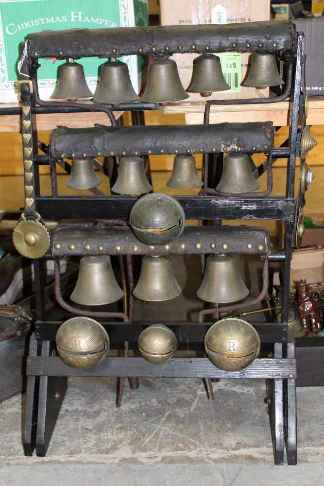 Lot 3785 - Impressive group of heavy horse bells mounted on a display stand