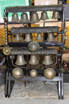 Lot 3785 - Impressive group of heavy horse bells mounted on a display stand