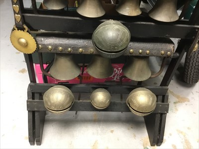 Lot 3785 - Impressive group of heavy horse bells mounted on a display stand