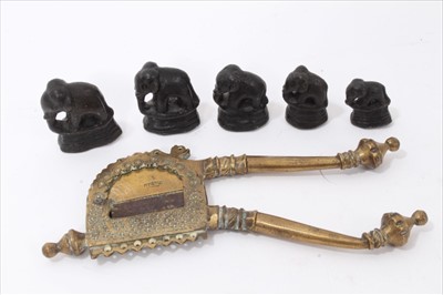 Lot 3830 - Set of five graduated brass elephant weights and brass cutter