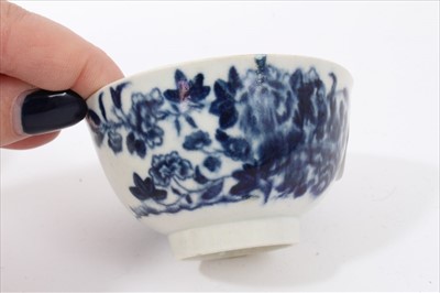 Lot 20 - Four 18th century Worcester blue and white tea bowls, to include one with Cannonball pattern, one with Birds in Branch pattern, one with Prunus Root pattern, and the other with birds flying over an...