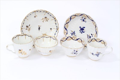 Lot 21 - Two 18th century English porcelain trios, to include a Flight Worcester set, circa 1785, spiral moulded with blue and gold floral sprays, and a Caughley set, circa 1790, with waved edges and simila...