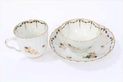 Lot 21 - Two 18th century English porcelain trios, to include a Flight Worcester set, circa 1785, spiral moulded with blue and gold floral sprays, and a Caughley set, circa 1790, with waved edges and simila...