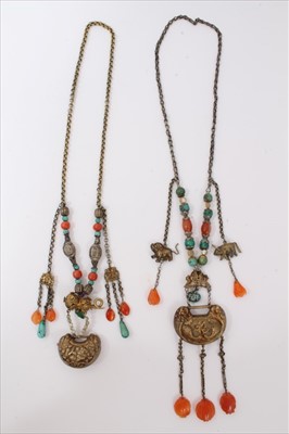 Lot 3483 - Two old Chinese necklaces with white metal panels and carved agate, coral and mother of pearl beads