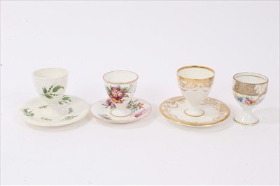 Lot 25 - Four early 19th century English porcelain egg cups, various floral and gilt patterns, one marked for Derby and the other three unmarked but probably Coalport (4)