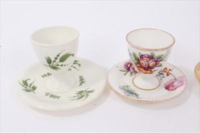 Lot 25 - Four early 19th century English porcelain egg cups, various floral and gilt patterns, one marked for Derby and the other three unmarked but probably Coalport (4)