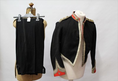 Lot 634 - Victorian Royal Artillery Colonel's dress jacket with bullion epaulettes and trim, together with a pair of later trousers and a tin trunk (3)