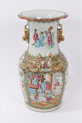 Lot 44 - Late 19th century Chinese famille rose baluster vase, painted in the Canton style with figural scenes, flowers and birds, with moulded foo dog handles and dragons, 33.5cm height