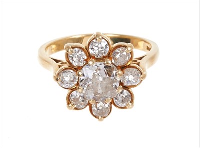 Lot 357 - Diamond cluster ring with a flower head cluster of nine old cut diamonds in gold setting