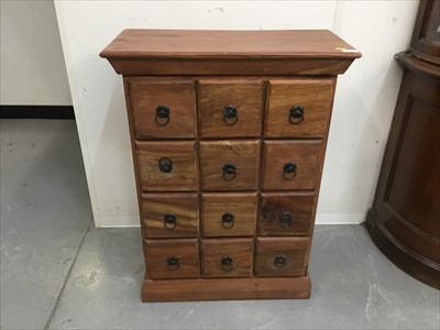 Lot 809 - Eastern hardwood nest of twelve drawers with iron ring handles